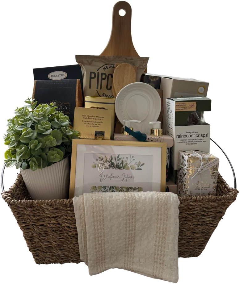 Gift basket with popcorn, a charcuterie board, a plant and a framed welcome print